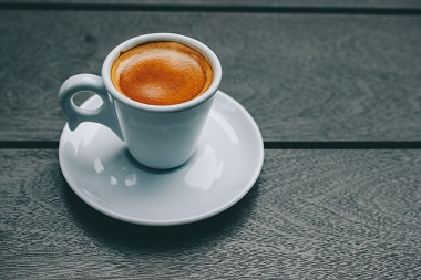 Why the ear of the coffee cup be placed on the left hand position?